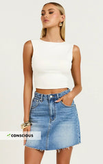 Adan Mini Skirt - Recycled Cotton Frayed Hem Denim Skirt in Mid Blue Wash