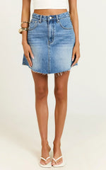 Adan Mini Skirt - Recycled Cotton Frayed Hem Denim Skirt in Mid Blue Wash